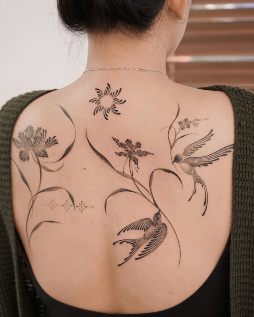 Graceful Swallows and Flowers Back Tattoo Tattoo Design