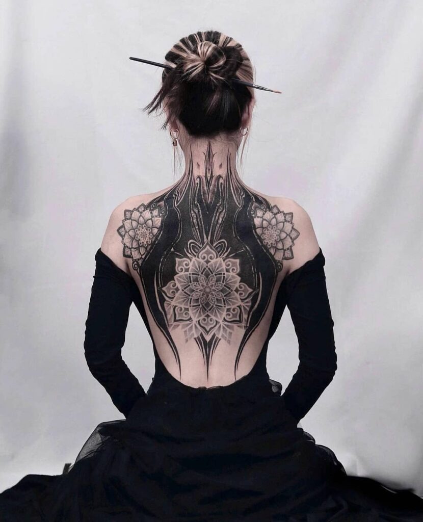 Ornamental Mandala Back Tattoo with Blackwork Accents Tattoo Design