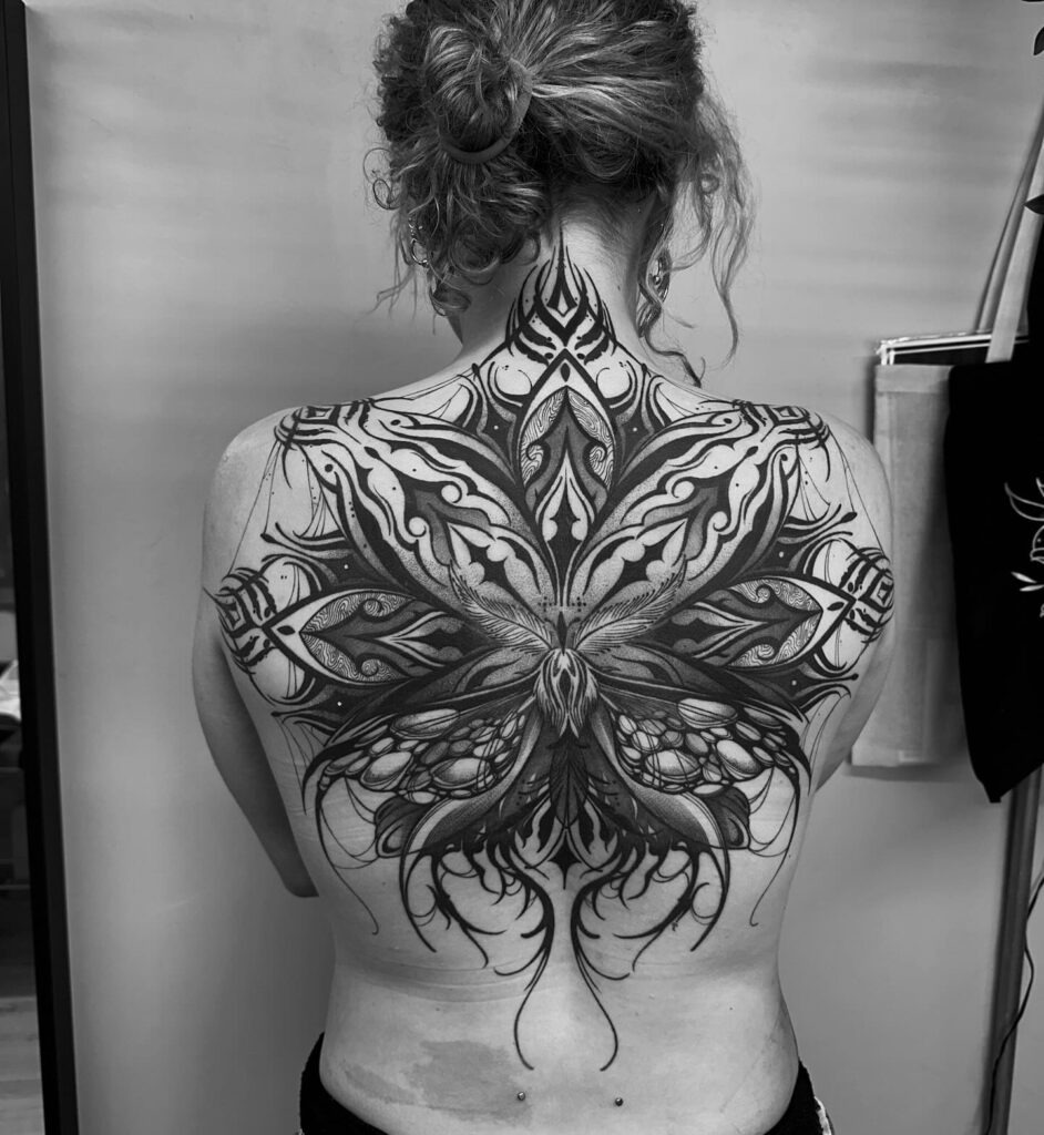Ornamental Moth Back Tattoo with Symmetrical Detailing Tattoo Design