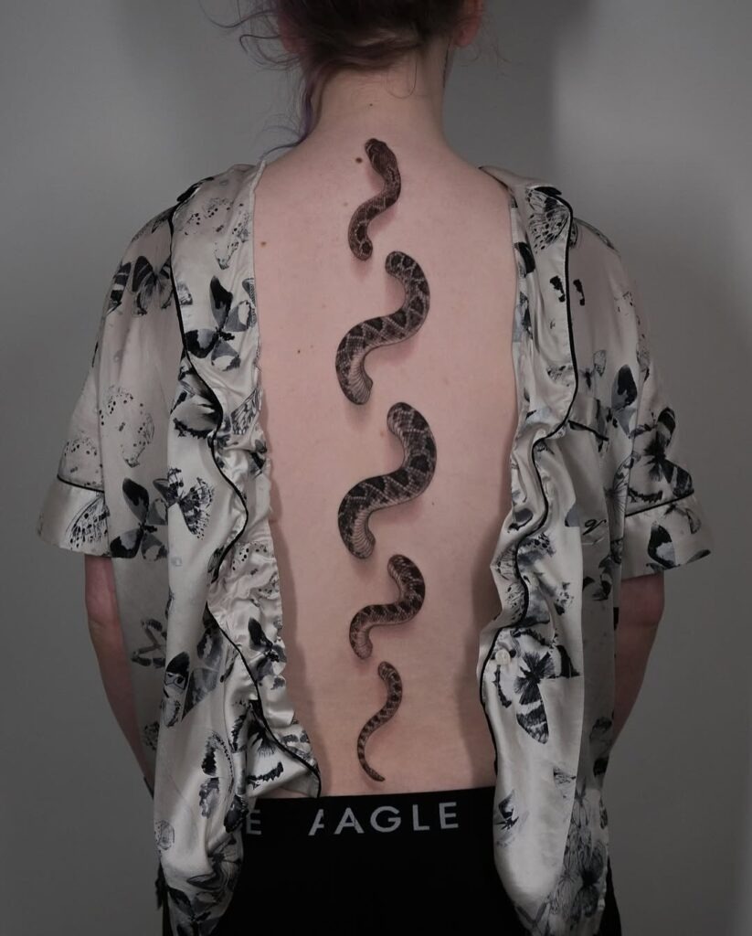 Realistic Snake Spine Tattoo with Flowing Curves Tattoo Design