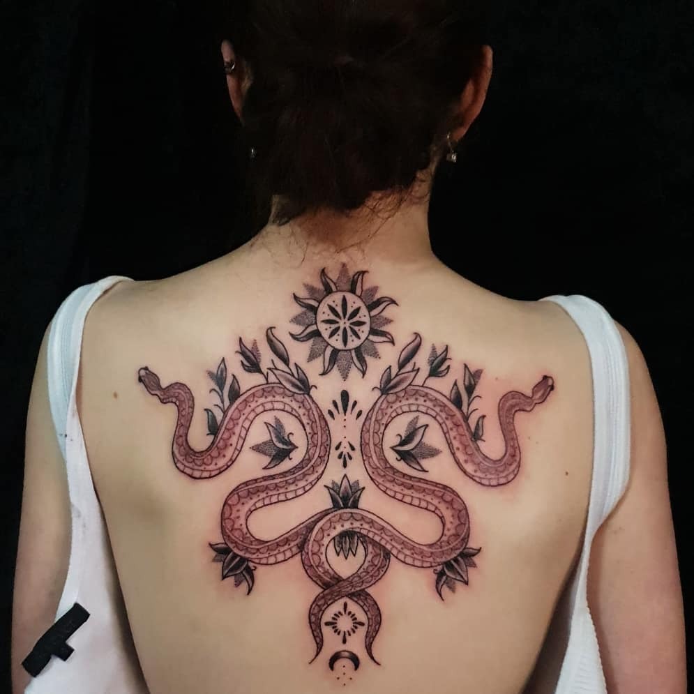 Twin Serpents with Celestial Accents Tattoo Design
