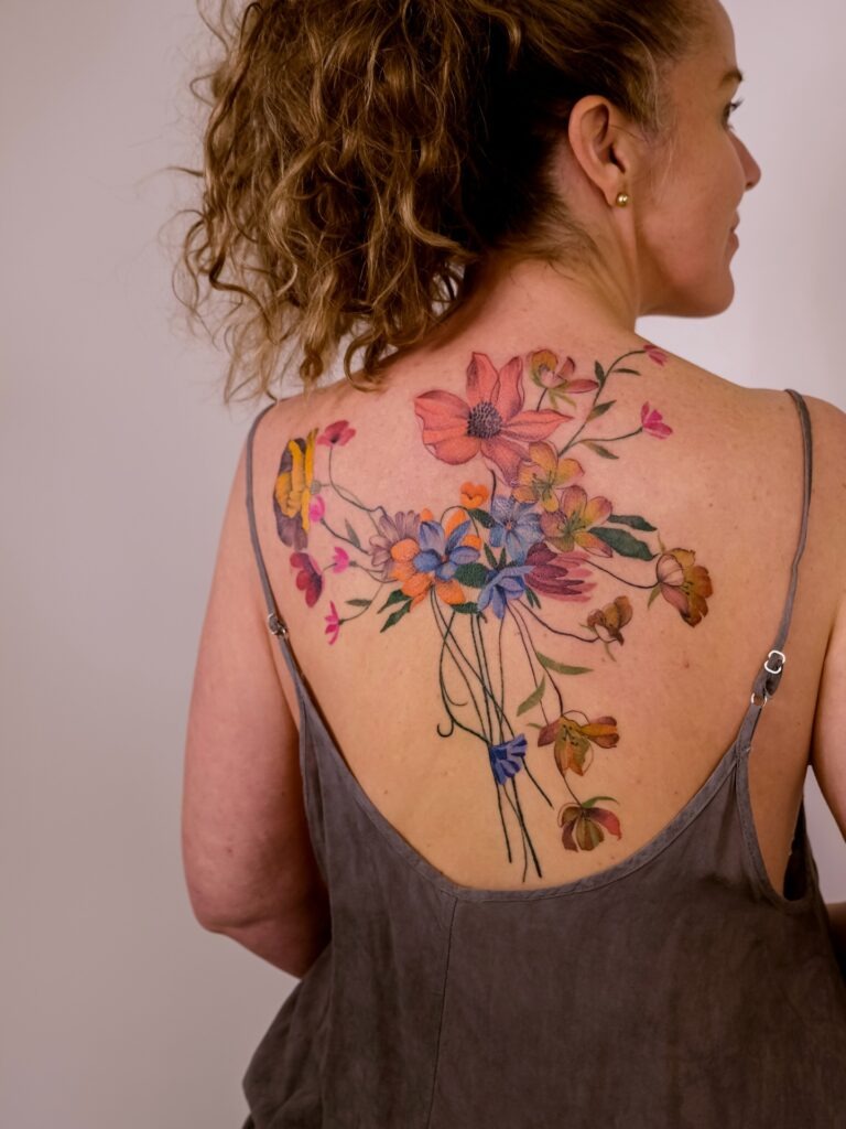 Vibrant Wildflower Bouquet Back Tattoo Tattoo Design