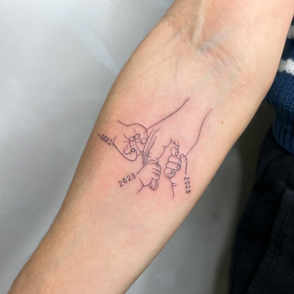 Family Hands Tattoo with Birth Years Tattoo Design
