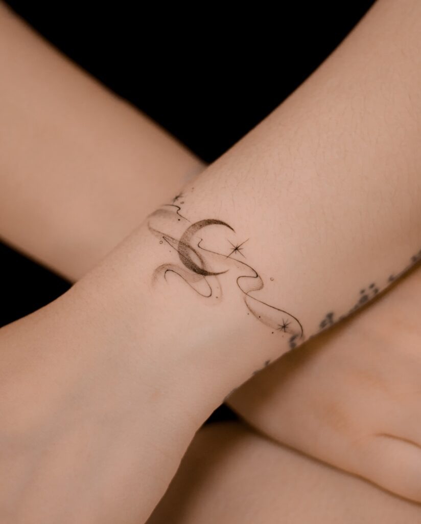 Flowing Moon Fine Line Tattoo Tattoo Design