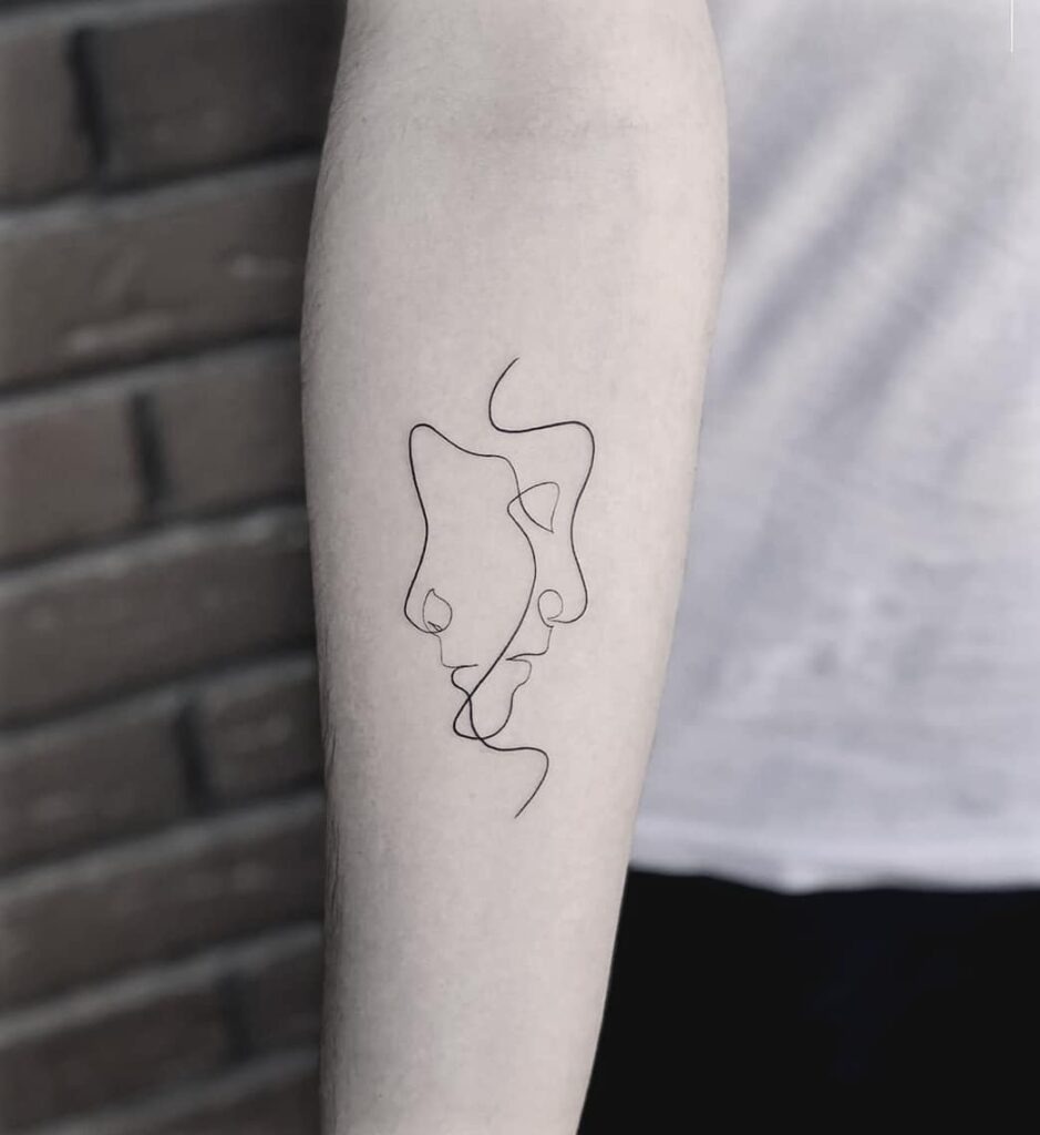 Minimalist One-Line Faces Tattoo Tattoo Design