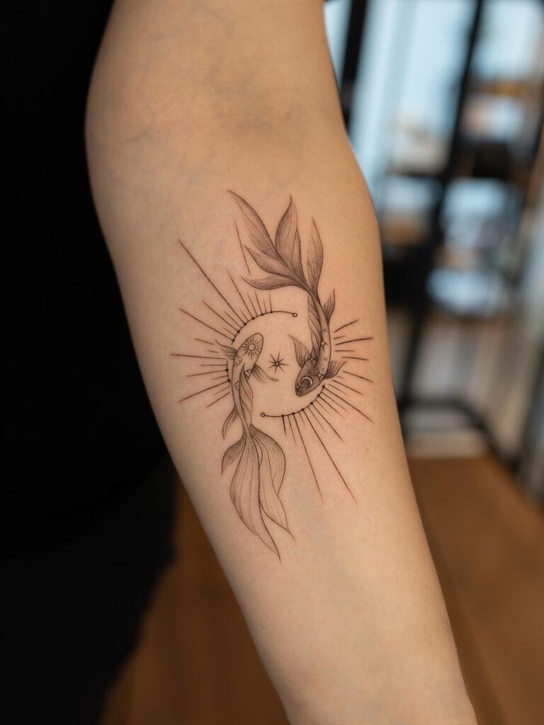 Yin Yang Koi Fish Tattoo with Radiant Lines Tattoo Design