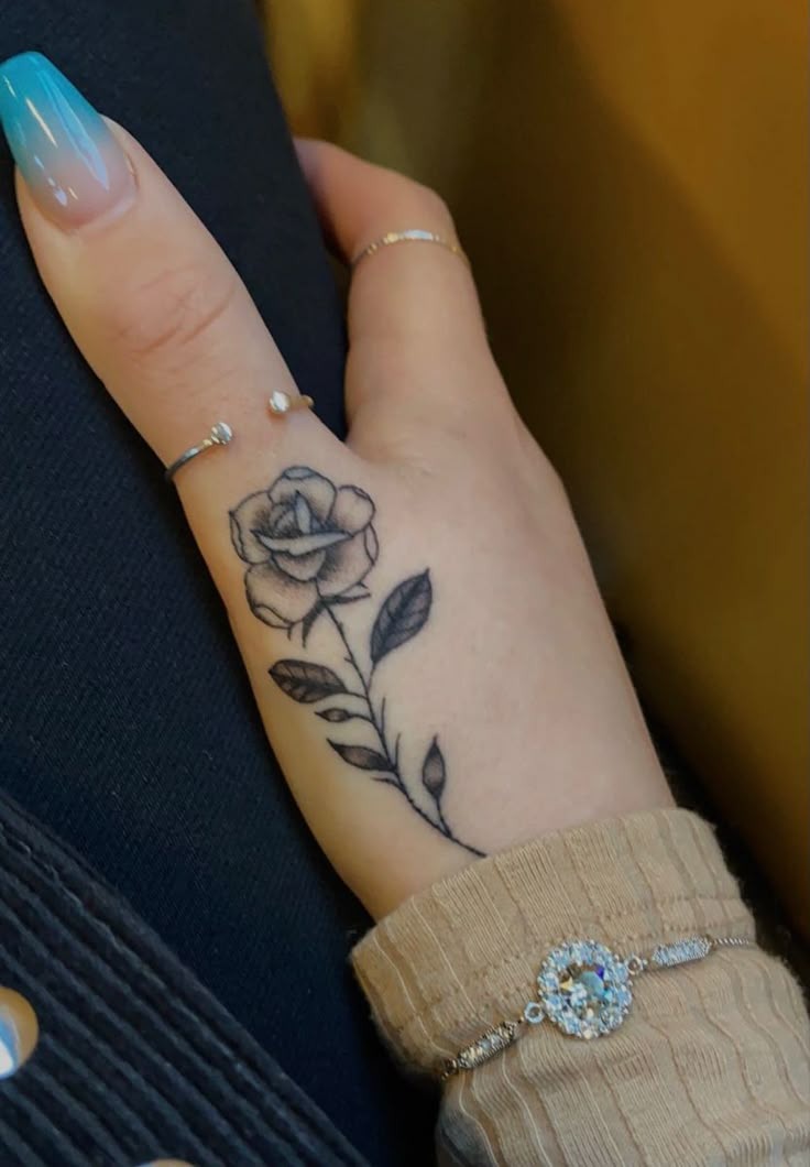 Detailed Rose on Side Finger Tattoo Design