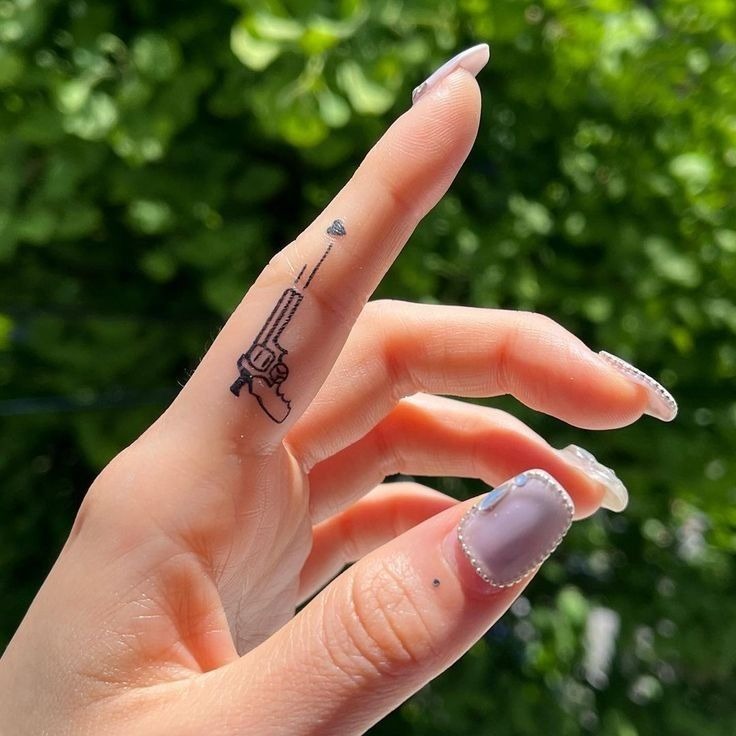 Gun and Heart Finger Tattoo Tattoo Design