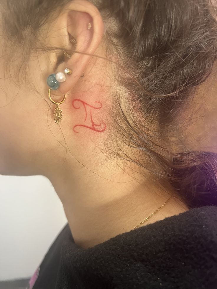 Red Gemini Ear Tattoo Tattoo Design