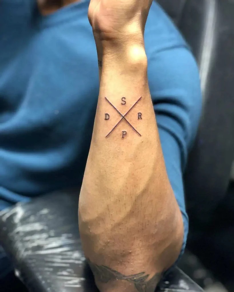 Crossed Letters Tattoo on Forearm Tattoo Design