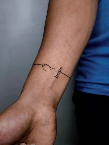 Hand-Holding and "Hope" Tattoo on Forearm Tattoo Design