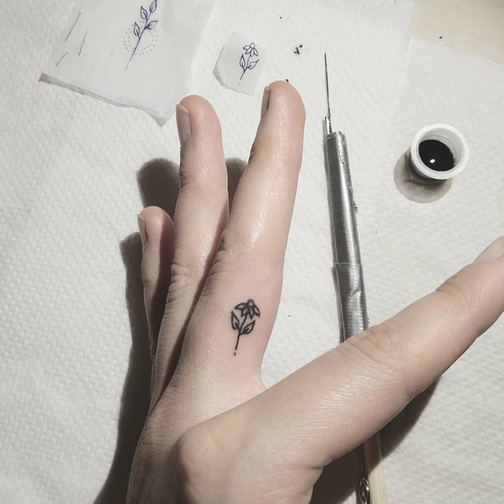 Tiny Flower Finger Tattoo Tattoo Design