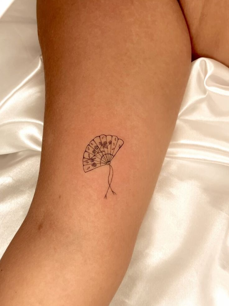 Delicate Fan Tattoo with Floral Details Tattoo Design