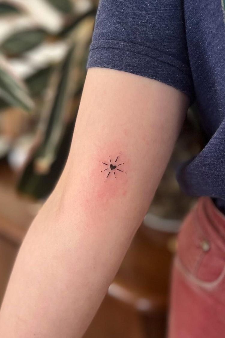 Tiny Radiating Heart Arm Tattoo Tattoo Design