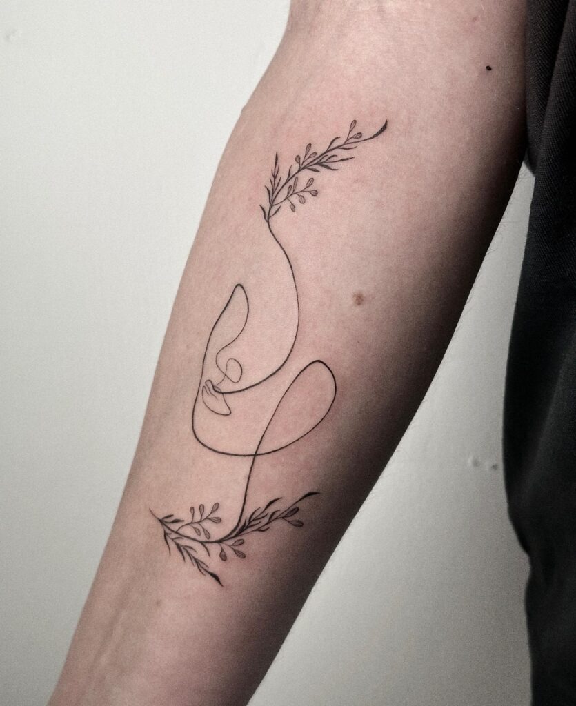 One Line Face with Botanical Accents Tattoo Tattoo Design