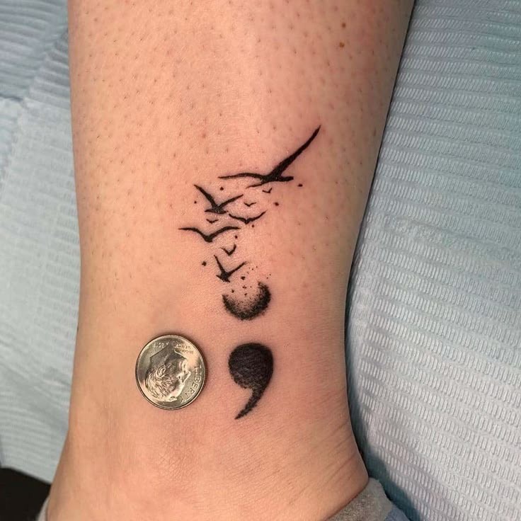 A watercolor-inspired take on the classic semicolon, this design features birds in flight, adding a sense of freedom and transformation.