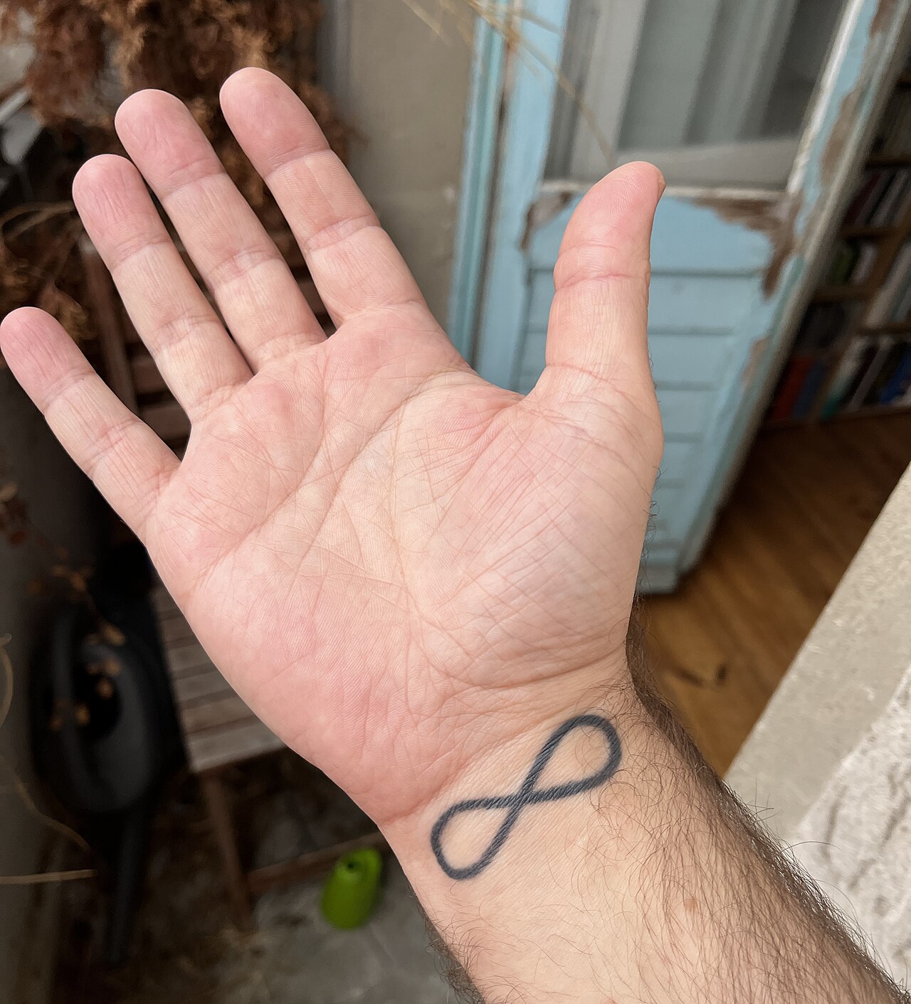 Infinity symbol tattoo on a wrist