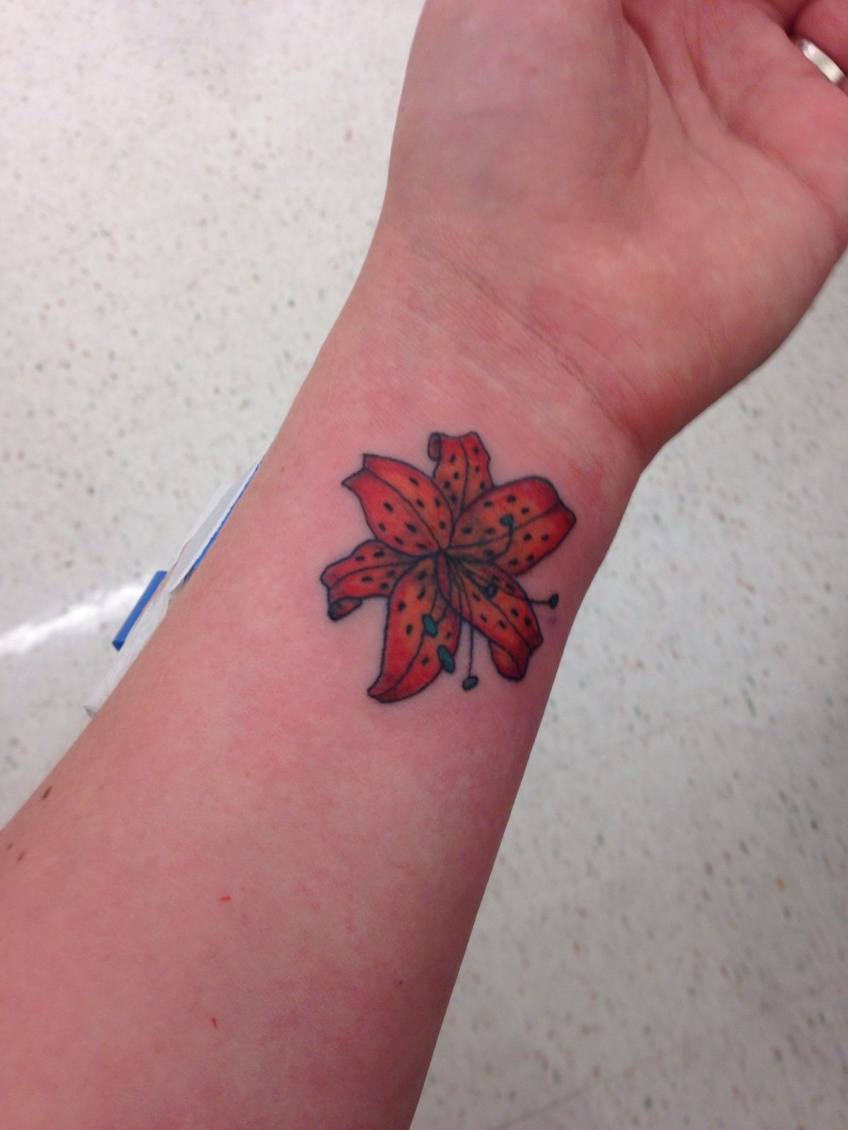 Small Simple Tiger Lily Wrist Tattoo Tattoo Design