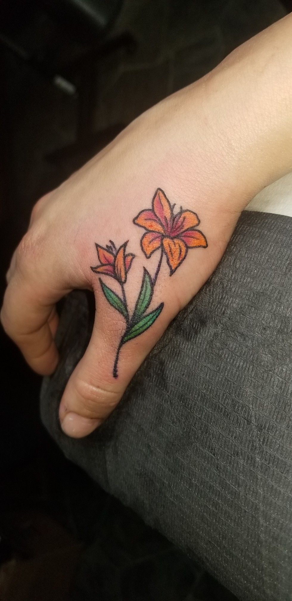 Tiny Tiger Lily Hand Tattoo Tattoo Design