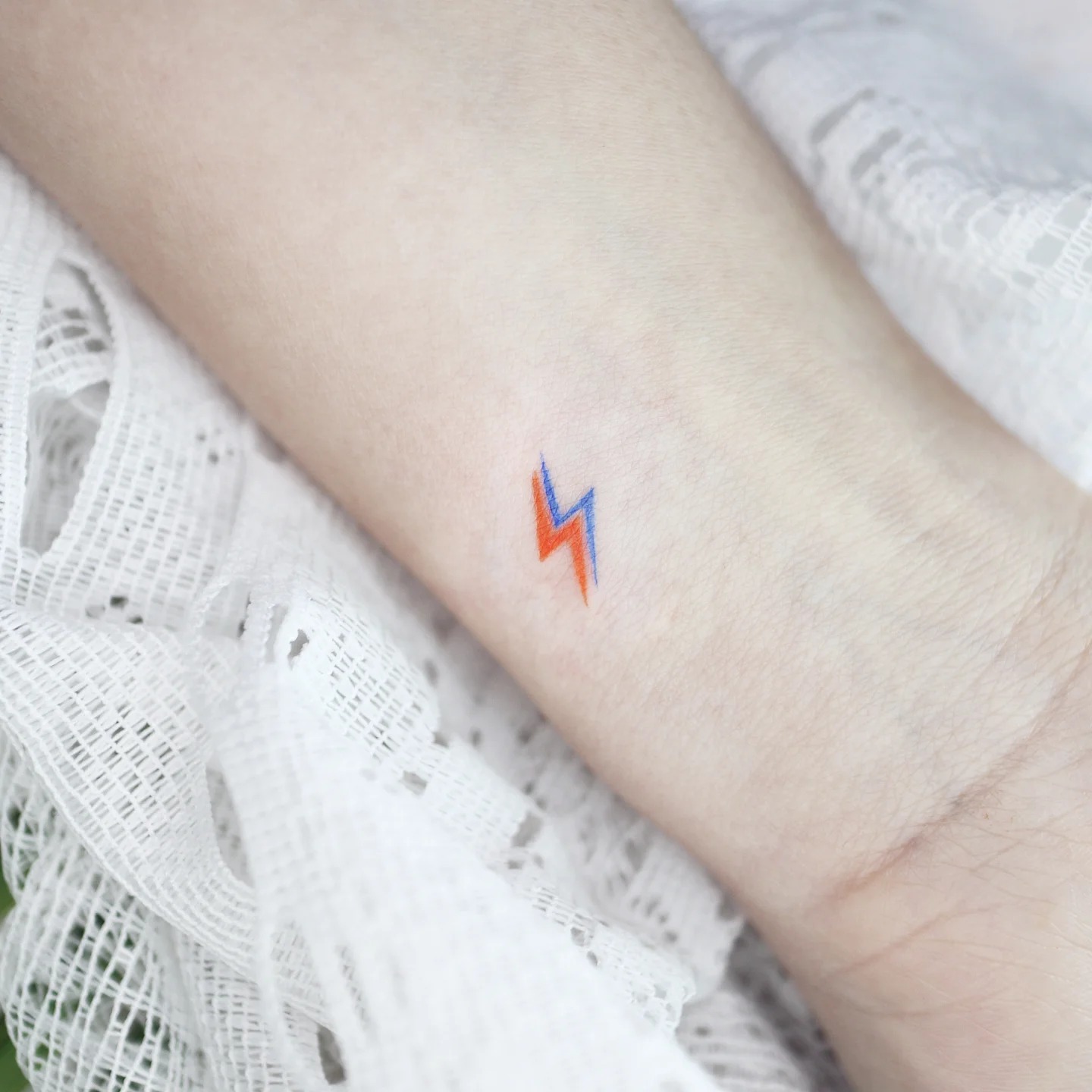 Tiny Dual Color Lightning Bolt Wrist Tattoo Tattoo Design