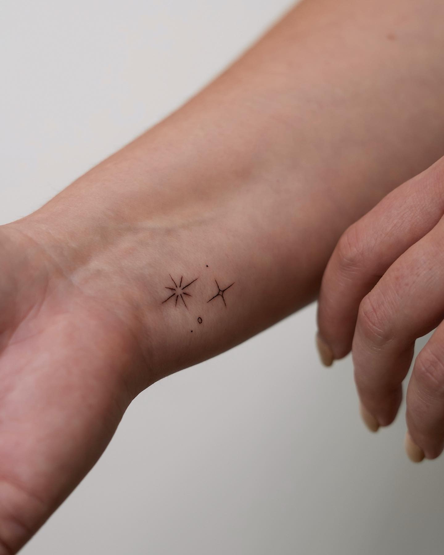 Tiny Minimal Star Pair Wrist Tattoo Tattoo Design