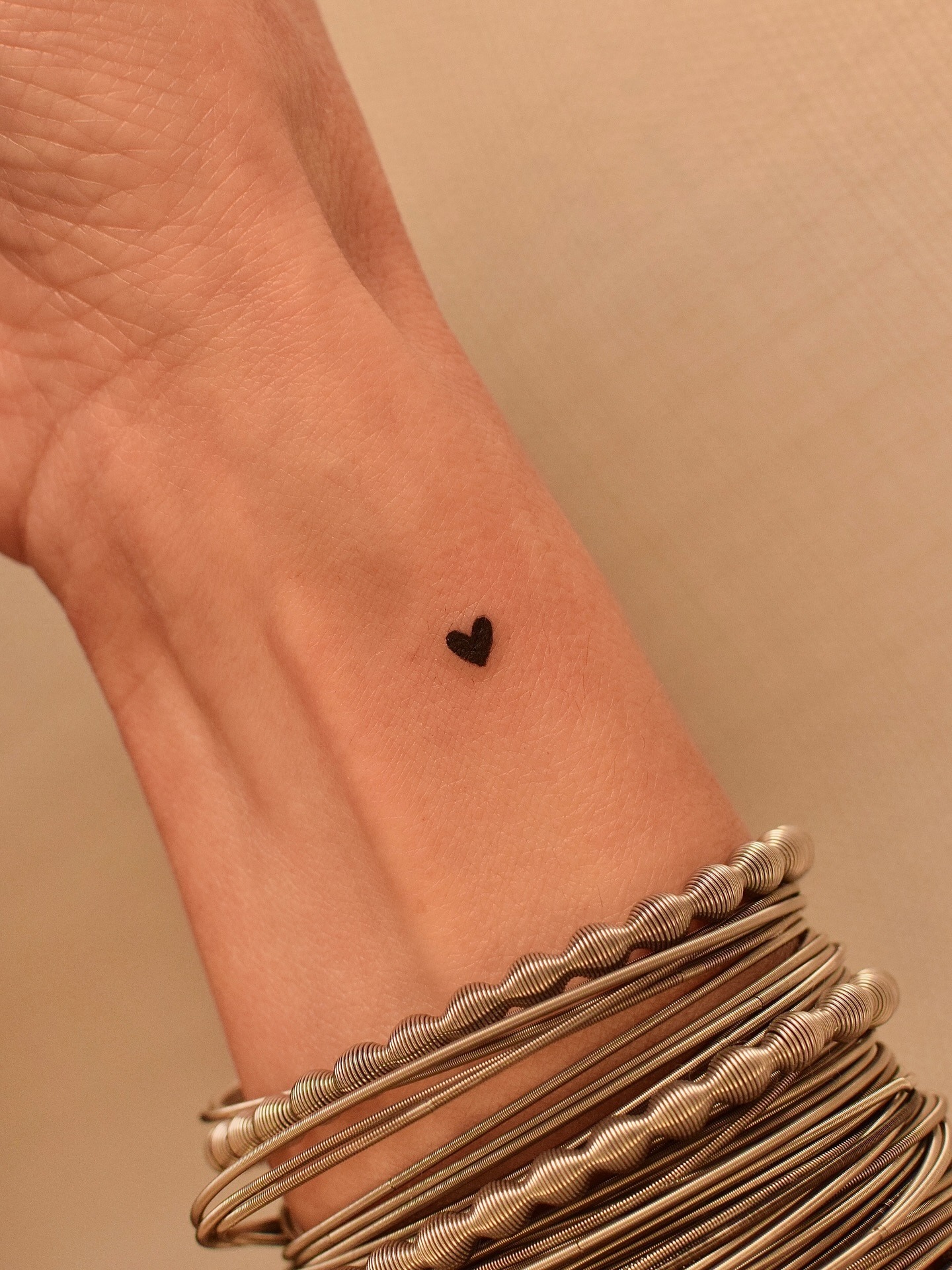 Tiny Solid Heart Wrist Tattoo Tattoo Design