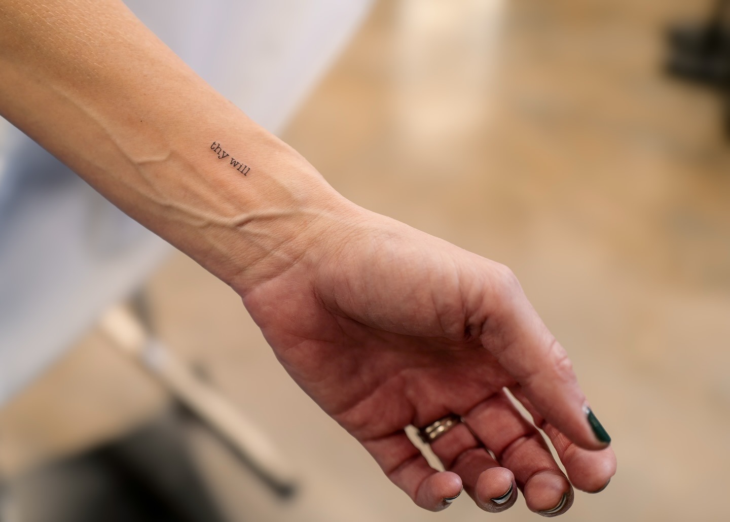 Tiny “Thy Will” Script Wrist Tattoo Tattoo Design
