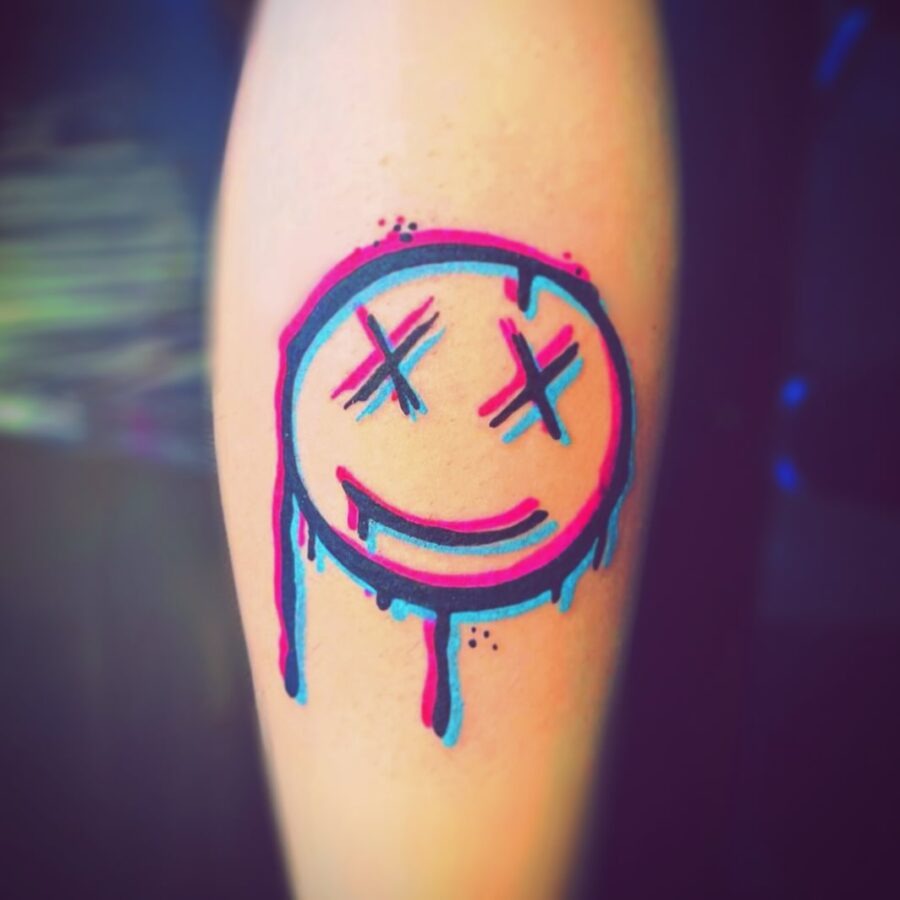Artistic Smiley Face Tattoo with Drips Tattoo Design