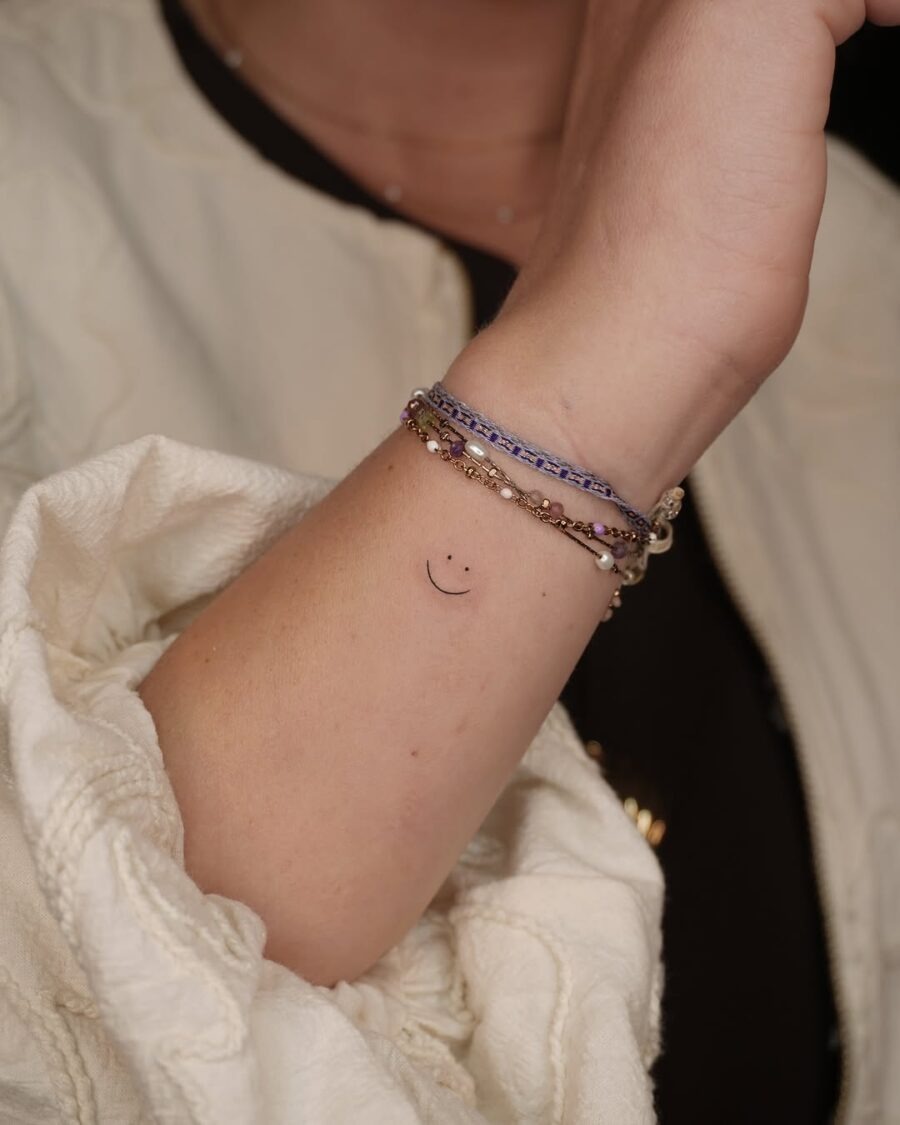 Charming minimalist smiley face tattoo design Tattoo Design