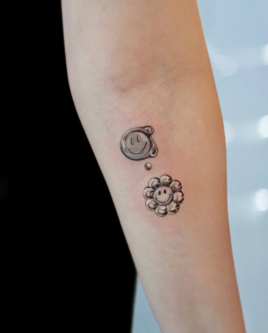 Charming smiley and flower tattoo combination Tattoo Design