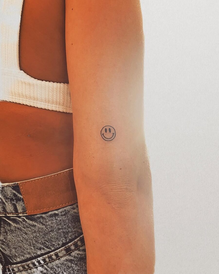 Charming Smiley Face Tattoo on Arm Tattoo Design