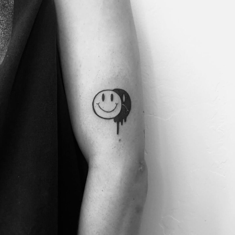 Charming smiley face tattoo with artistic flair Tattoo Design
