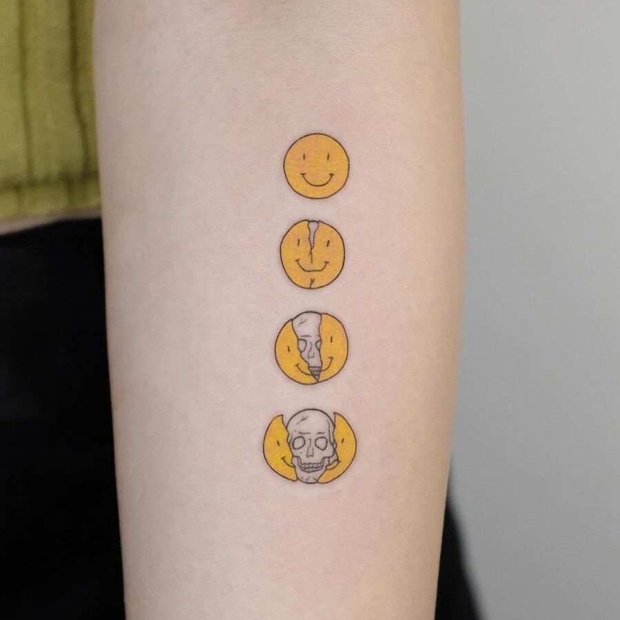 Four Faces: Happiness to Somberness in Ink Tattoo Design