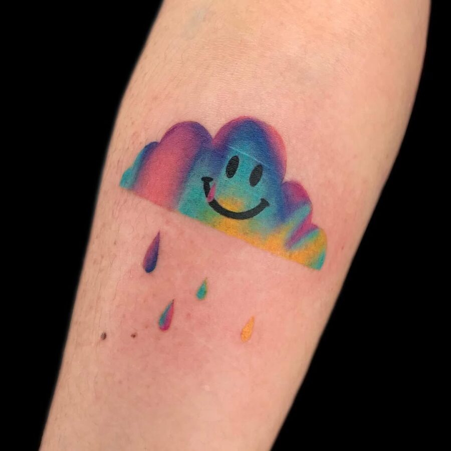Joyful smiley cloud tattoo with rainbow hues Tattoo Design