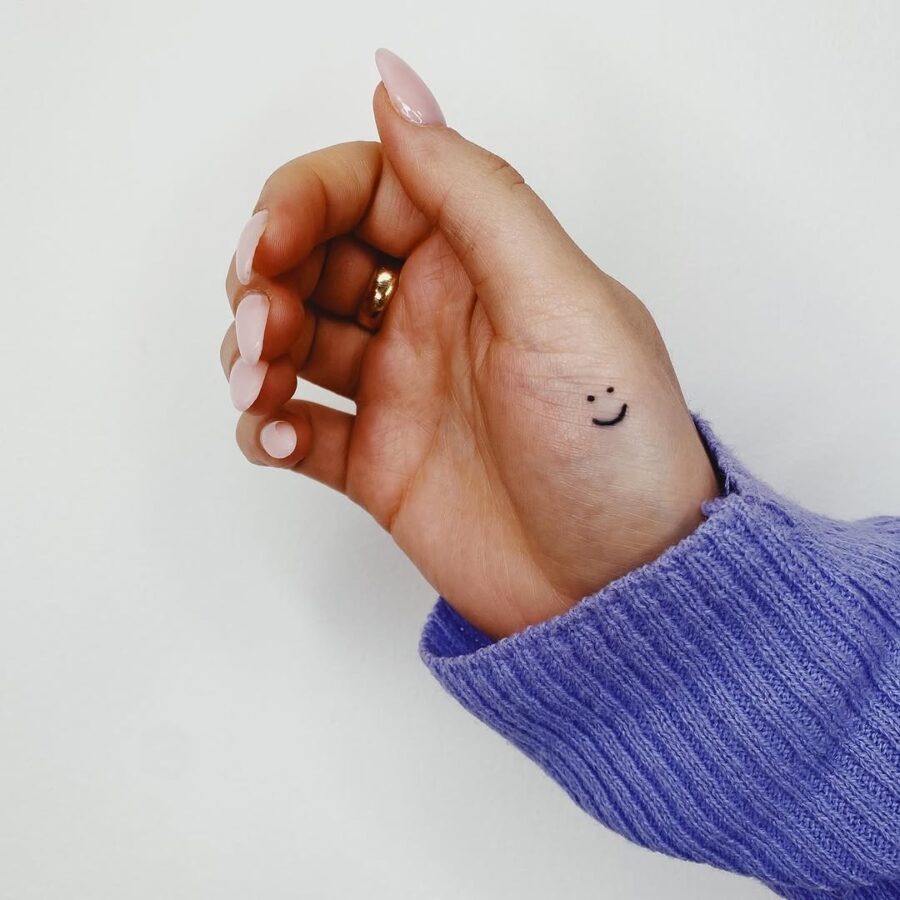 Minimalistic Smiley Face Tattoo on Hand Tattoo Design