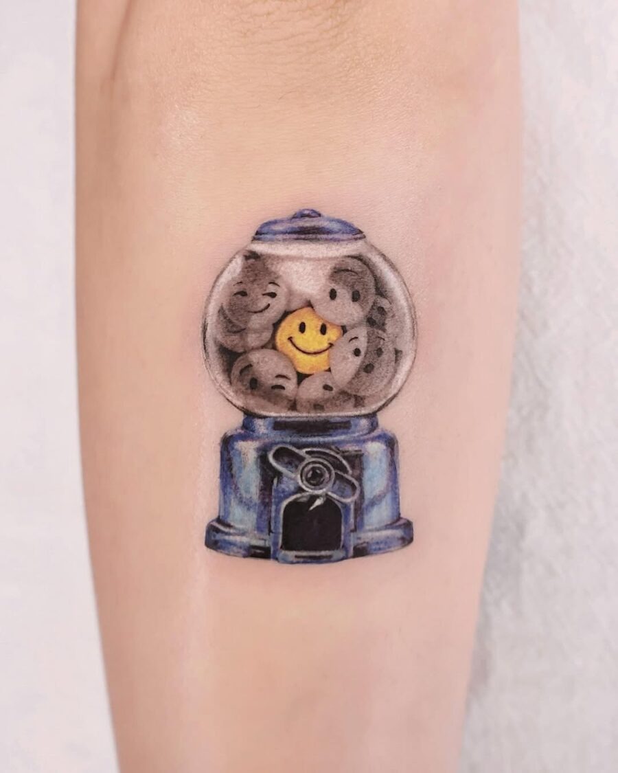 Playful smiley face gumball machine tattoo Tattoo Design
