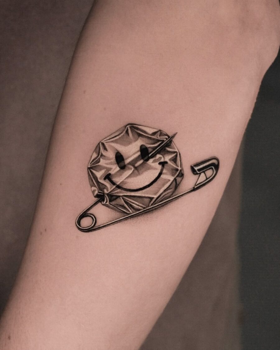 Playful smiley face tattoo with a twist Tattoo Design