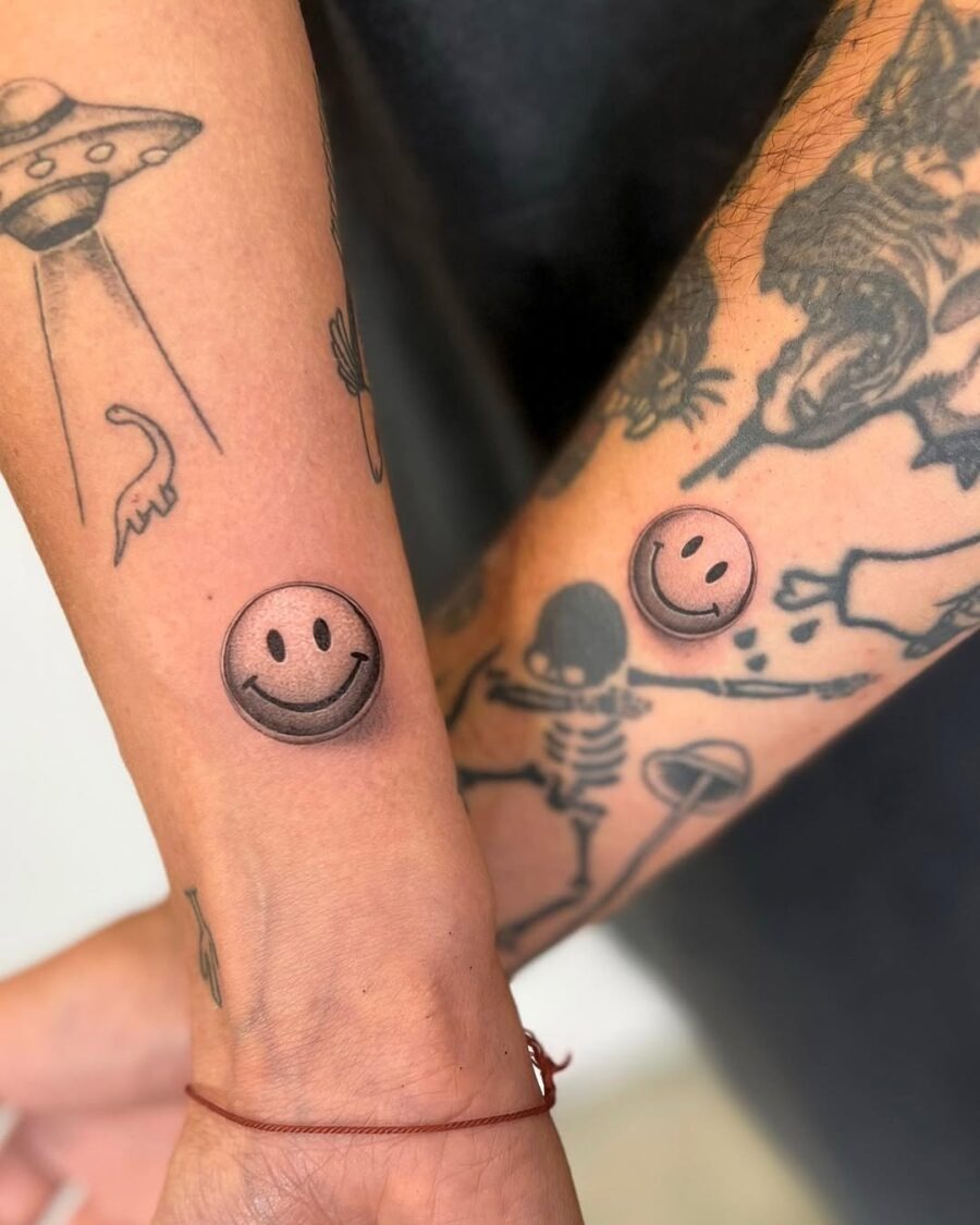 Playful smiley face tattoos on the forearm Tattoo Design