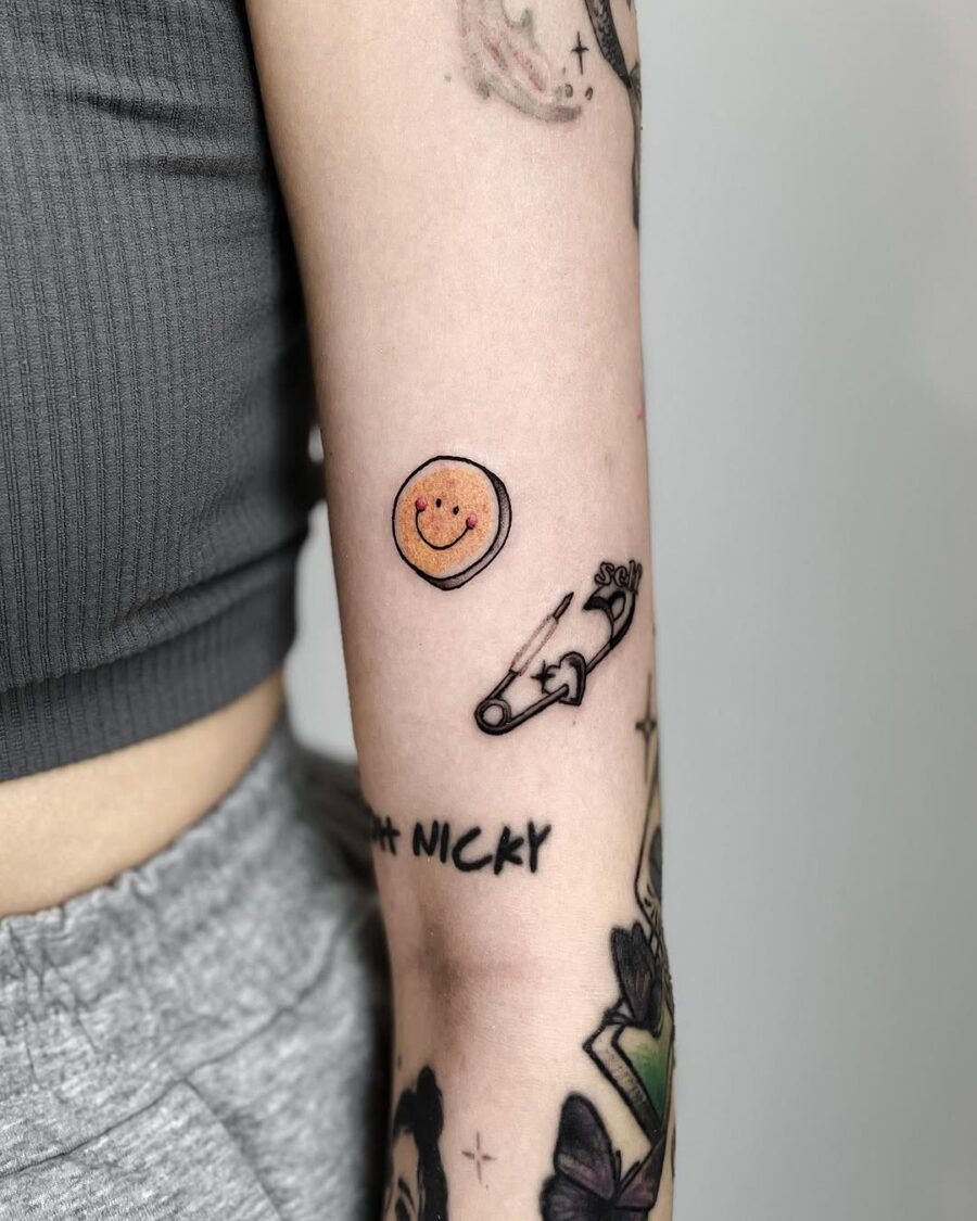 Vibrant smiley face tattoo with a unique twist Tattoo Design