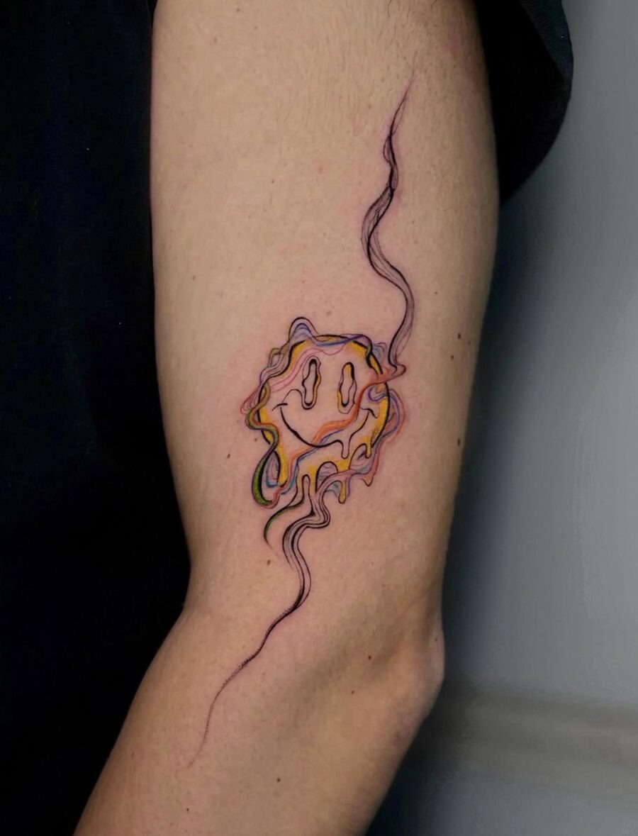 Vibrant Smiley Face Tattoo with Swirling Lines Tattoo Design