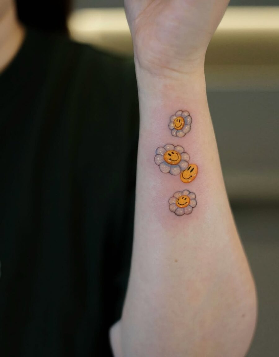 Vibrant smiley flower tattoos for cheerful vibes Tattoo Design
