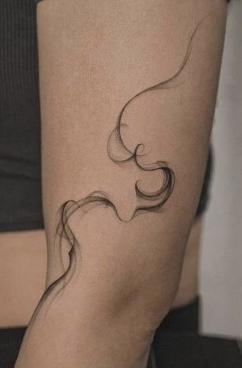 Delicate Curved Smoke Accent Tattoo Design