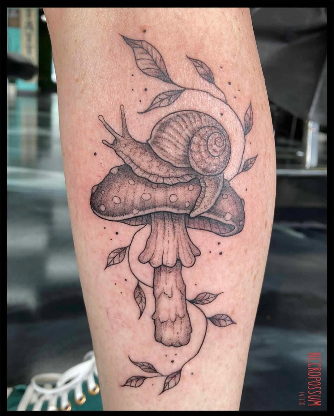 Charming snail on a whimsical mushroom tattoo Tattoo Design
