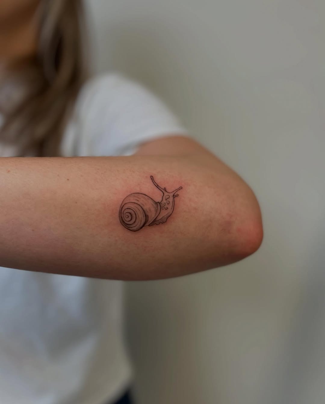 Charming snail tattoo on artistic expression Tattoo Design
