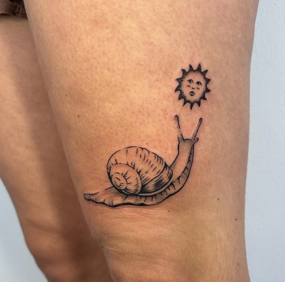 Charming snail tattoo with a sun illustration Tattoo Design