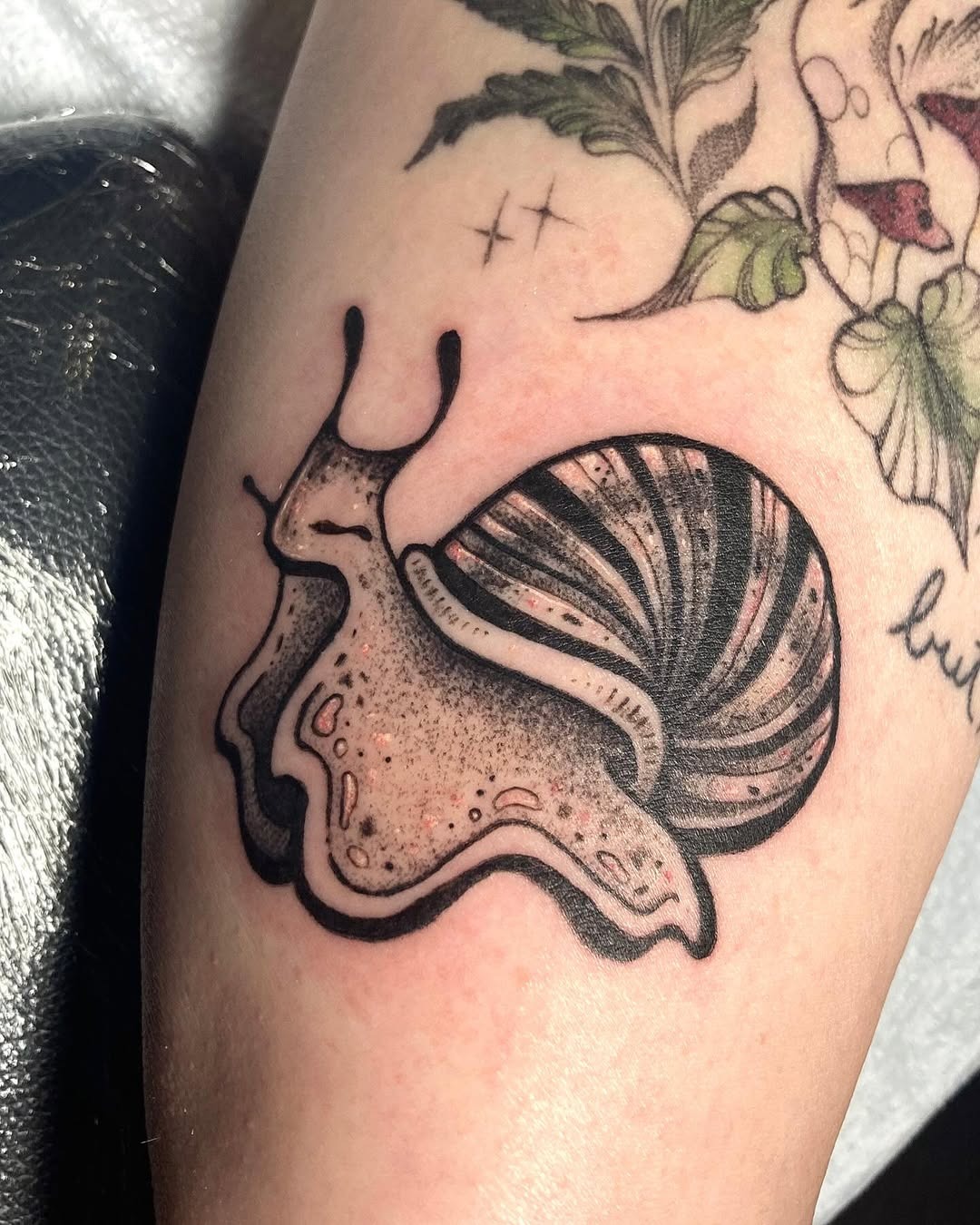 Charming snail tattoo with intricate details Tattoo Design