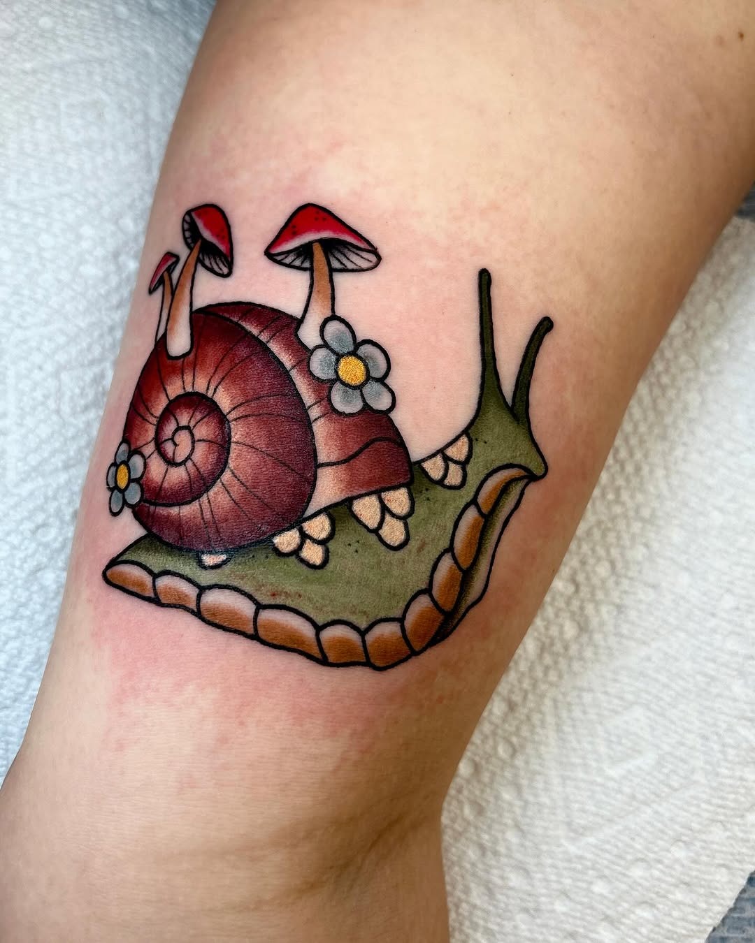 Charming snail tattoo with whimsical details Tattoo Design