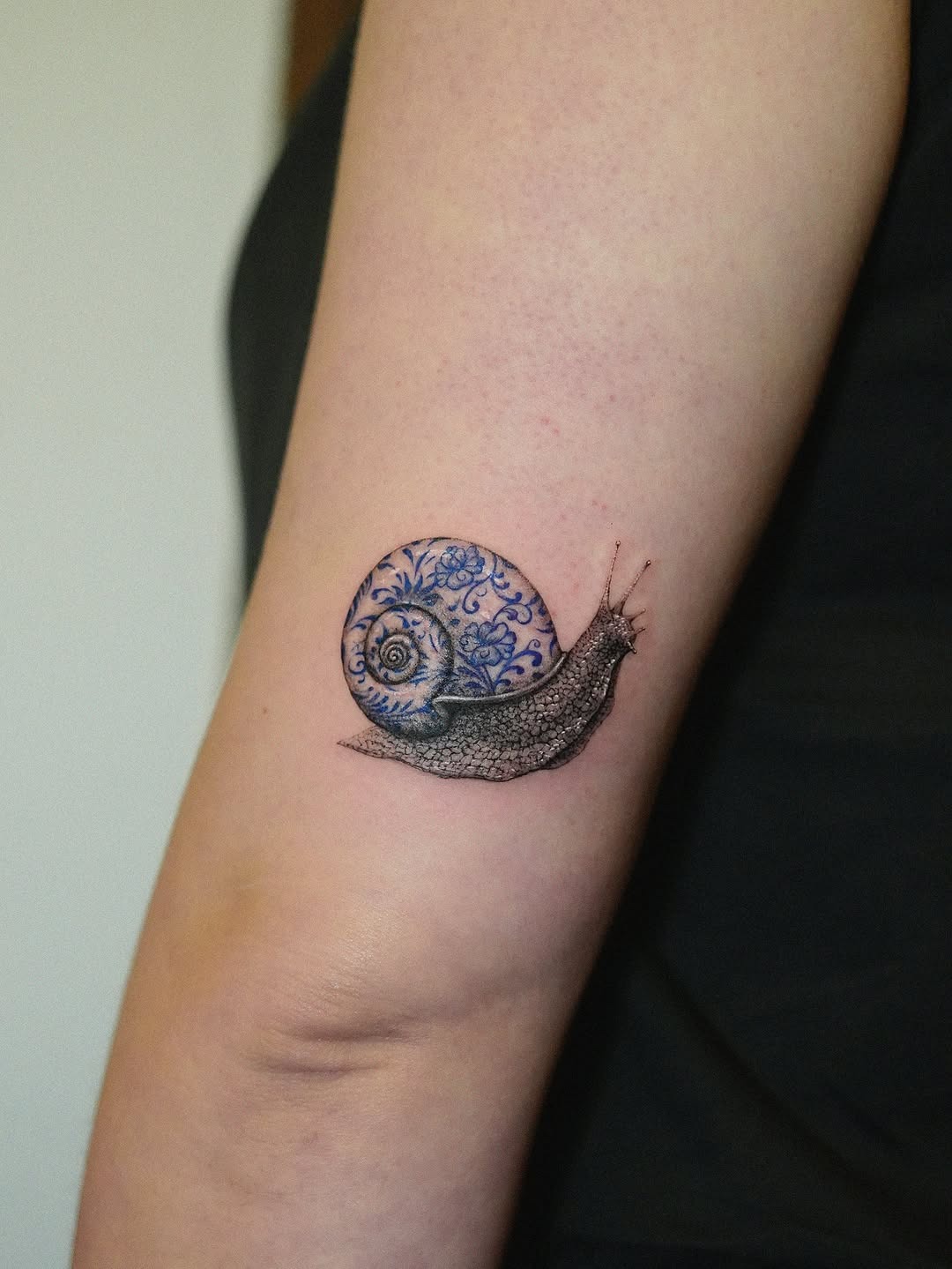 Intricate Snail Tattoo with Blue Floral Design Tattoo Design