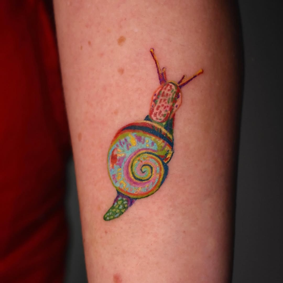 Vibrant snail tattoo showcasing intricate details Tattoo Design