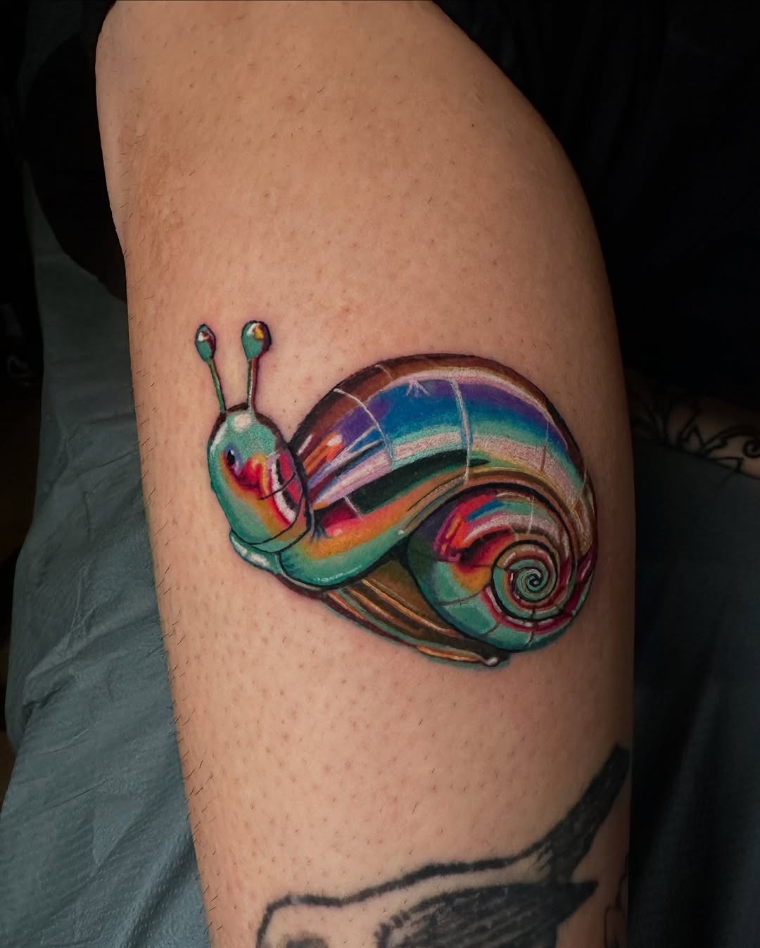 Vibrant Snail Tattoo with Iridescent Colors Tattoo Design